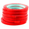 Stack of 6 red bag sealing tapes on rolls.
