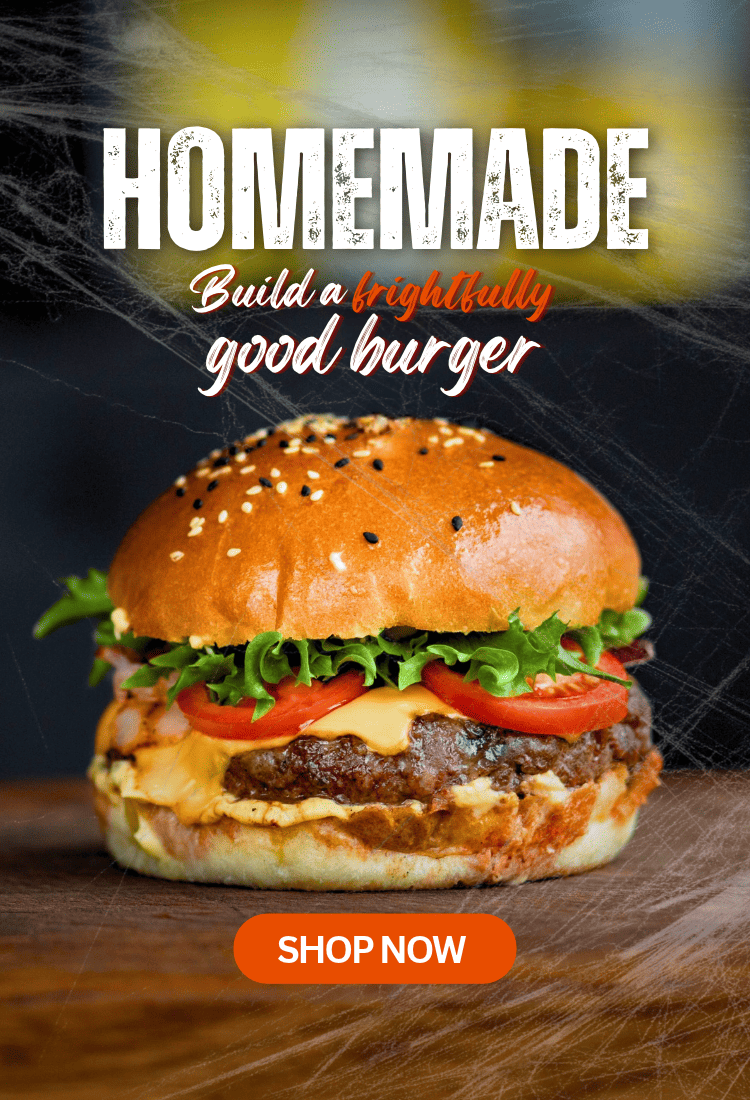 Halloween-themed banner featuring a homemade beef burger with cheese, lettuce and tomato, alongside the text “Homemade – Build a frightfully good burger” and a “Shop Now” button, with cobwebs in the background.