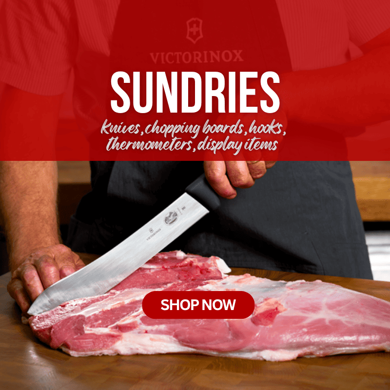 A Victorinox butcher knife with a black handle is shown being used to cut a large piece of raw pork belly on a wooden cutting board. The background features a red overlay with the text 'SUNDRIES' and a 'SHOP NOW' button.