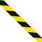 Black/yellow 33m hazard stripe tape unravelled.
