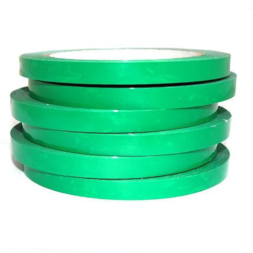 Stack of 6 green bag sealing tapes on rolls.