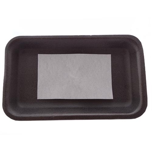 White meat saver soaker pad on black polystyrene tray.